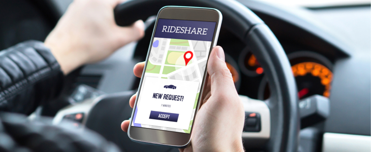 ridesharing sexual assault - Rideshare driver accepting new request on phone