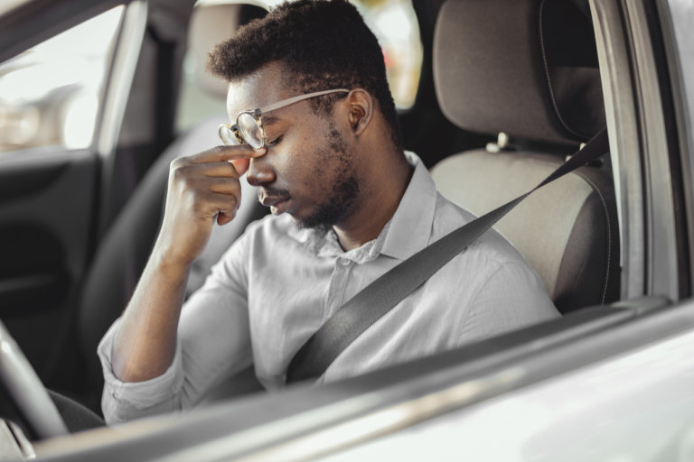 drowsy man behind the wheel of a car