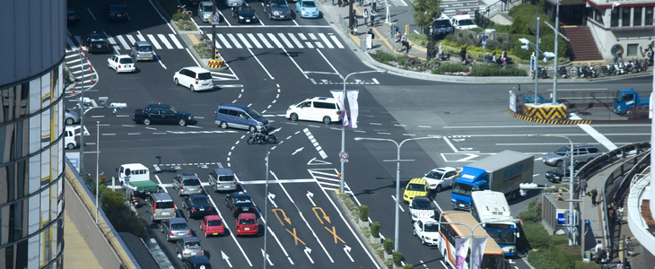 a large intersection with turning cars