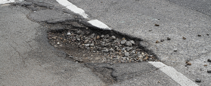 Large pothole on a busy Texas street