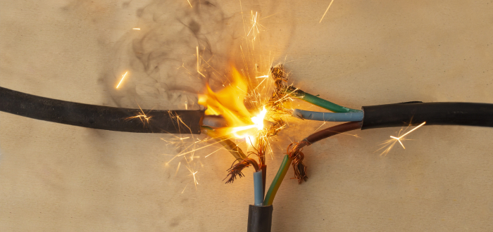 A wire ignites an electrical spark
