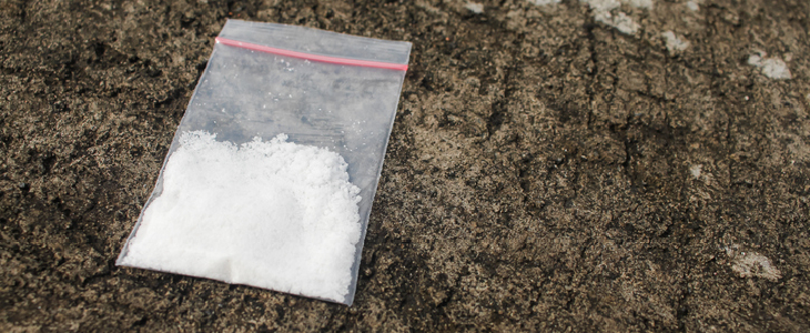 Small bag of cocaine on a granite table top