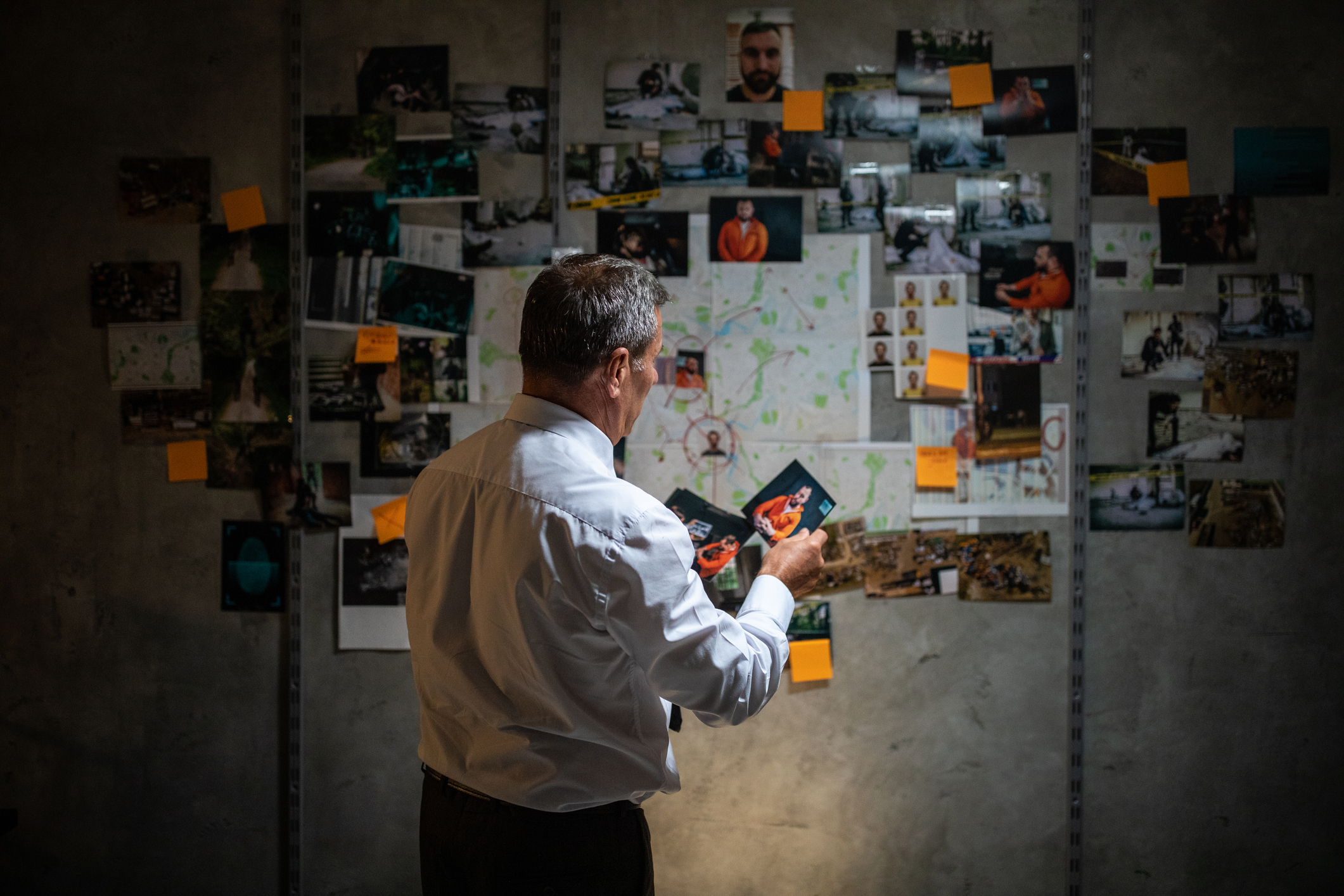 Criminal investigator looking at photos